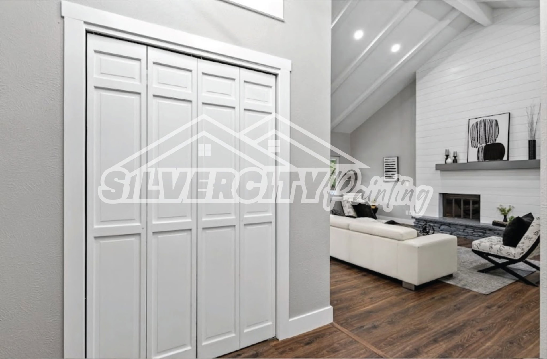 Interior hallway with painted closet doors leading to a white living room with shiplap fireplace