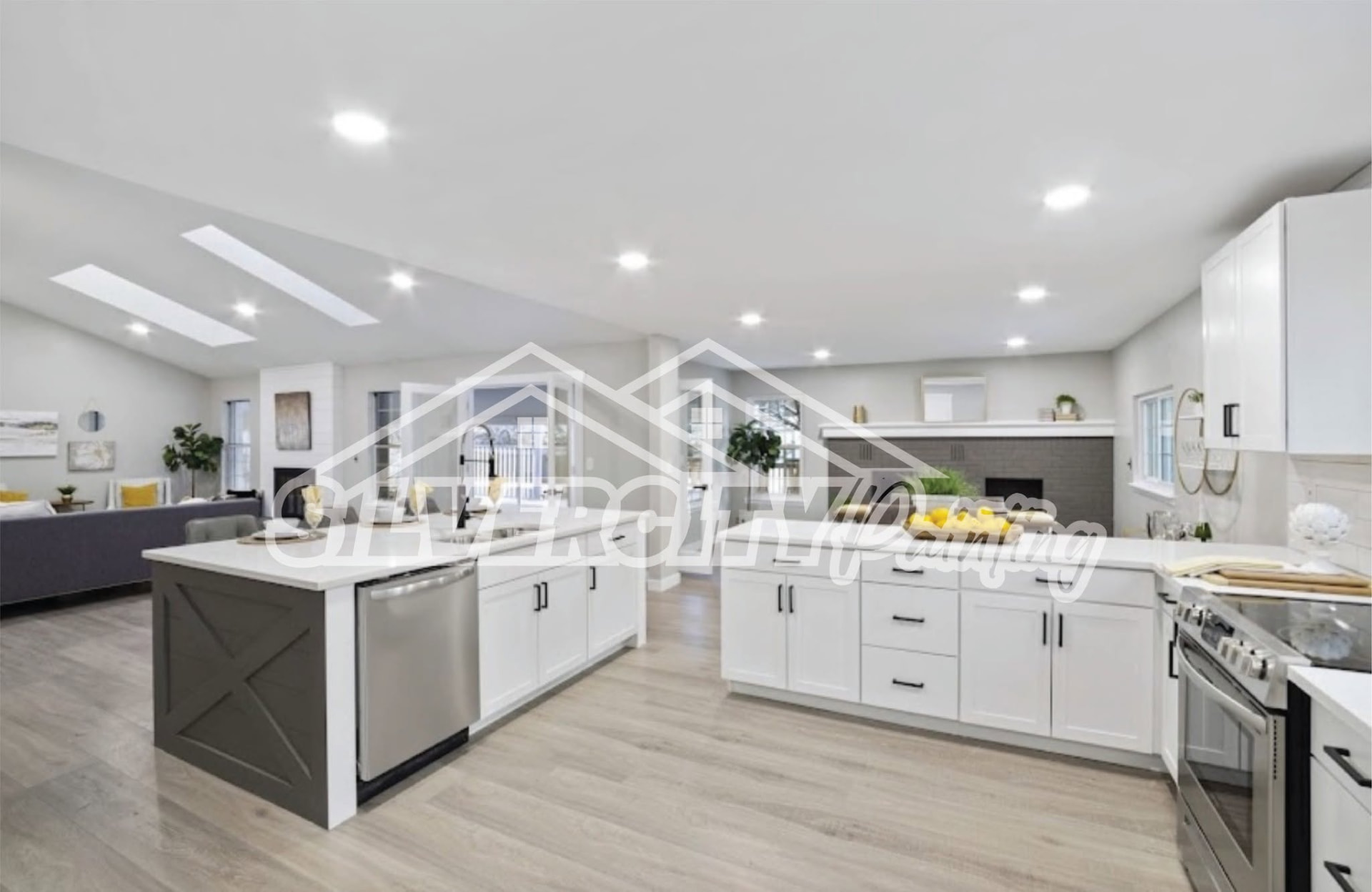 Large open kitchen with white cabinetry, grey island and painted brick fireplace